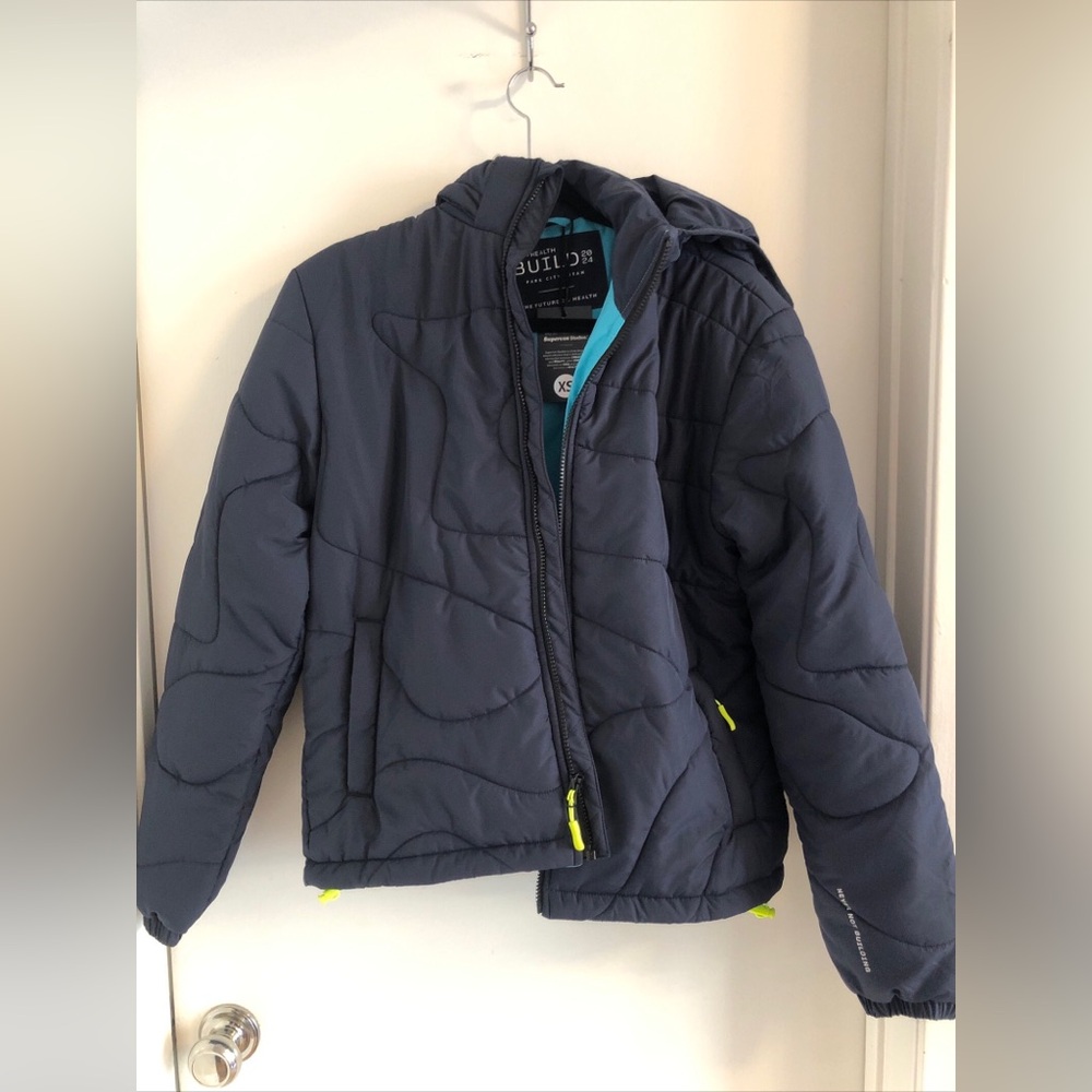 Supervsn Studios Bio + Health Build 2024 Blue Puffer Hooded Jacket